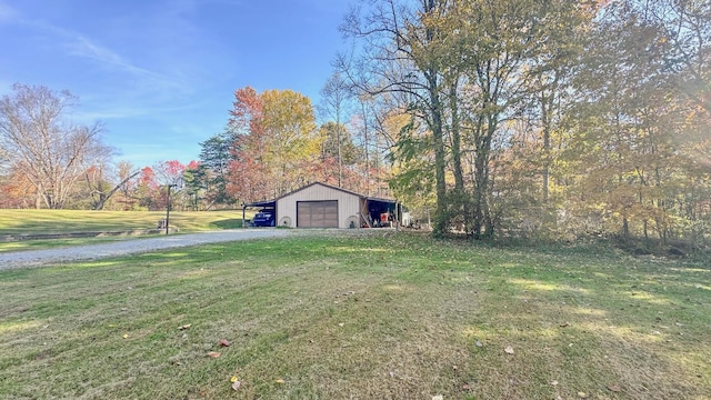 view of yard featuring an outdoor structure and a garage