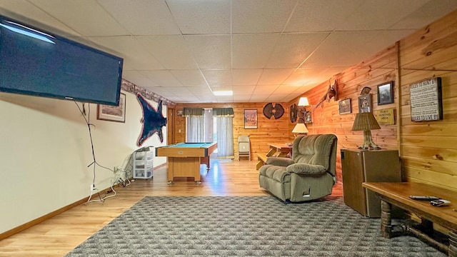 recreation room featuring a paneled ceiling, wooden walls, wood-type flooring, and pool table