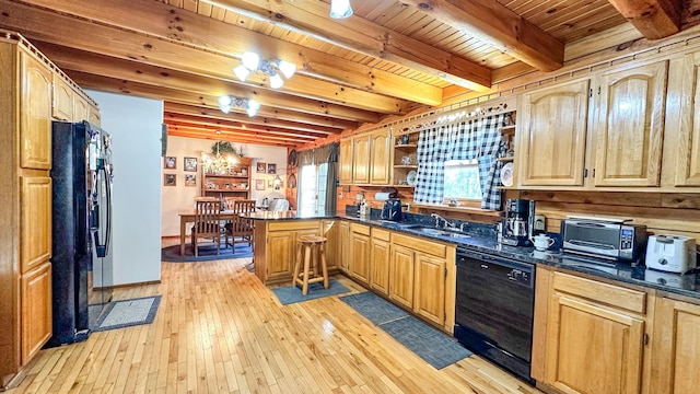 kitchen with beam ceiling, sink, kitchen peninsula, light hardwood / wood-style floors, and black appliances