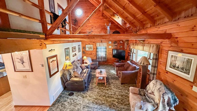 living room featuring wooden walls, beamed ceiling, wood ceiling, and hardwood / wood-style flooring