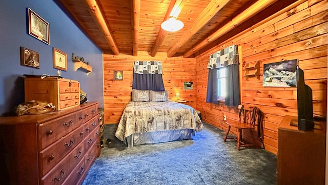 bedroom with wood walls, beamed ceiling, dark carpet, and wooden ceiling