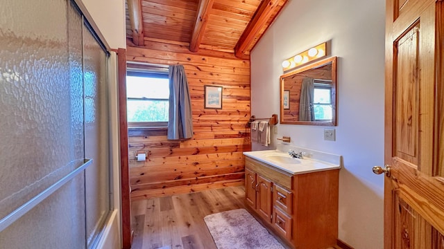 bathroom featuring hardwood / wood-style floors, vanity, wood walls, vaulted ceiling with beams, and wood ceiling