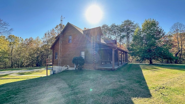 view of side of property with a lawn