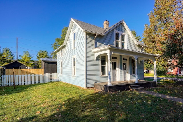 view of front of house with a porch and a front yard