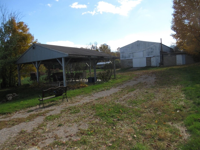 view of yard with a gazebo and an outdoor structure