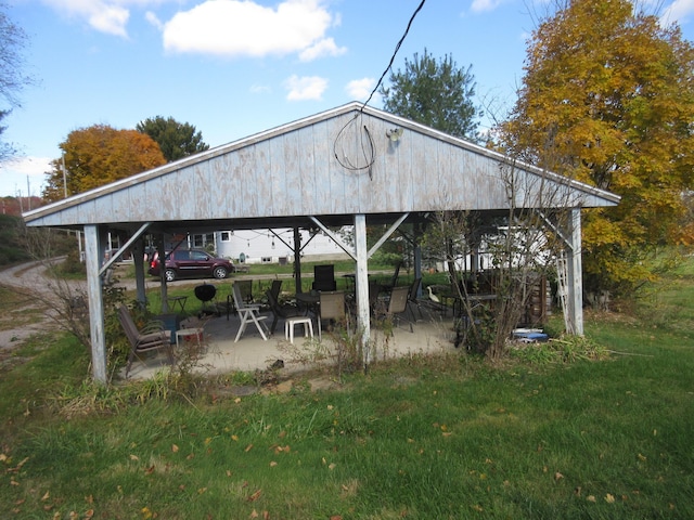 exterior space featuring a patio and a lawn