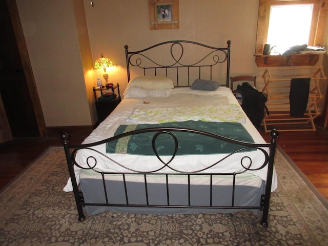 bedroom featuring wood-type flooring