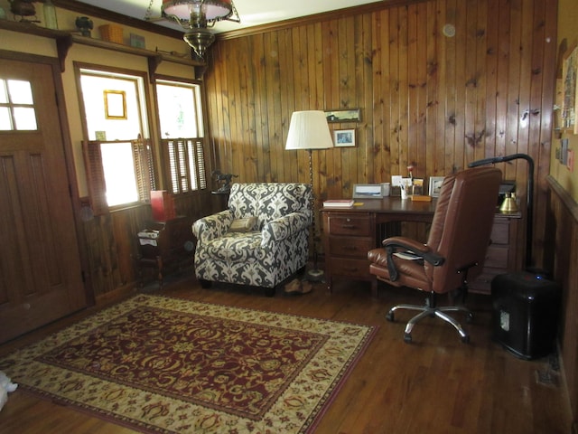 office space with wooden walls, dark hardwood / wood-style floors, and ornamental molding