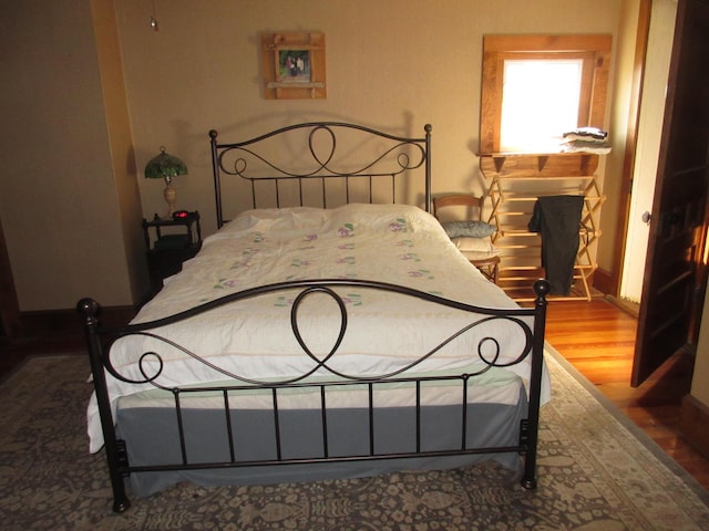 bedroom featuring wood-type flooring