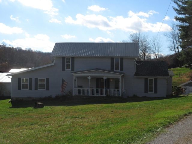 view of front of home featuring covered porch and a front yard