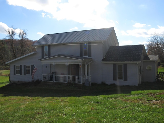 view of front of home featuring a porch and a front lawn