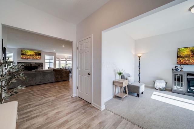 hall with light hardwood / wood-style floors