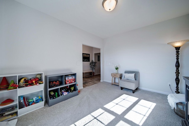 living area featuring carpet