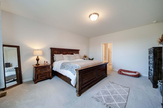 bedroom with light colored carpet