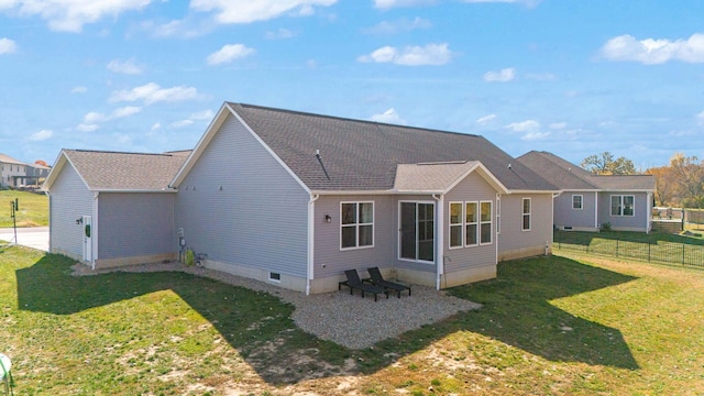 rear view of property featuring a lawn