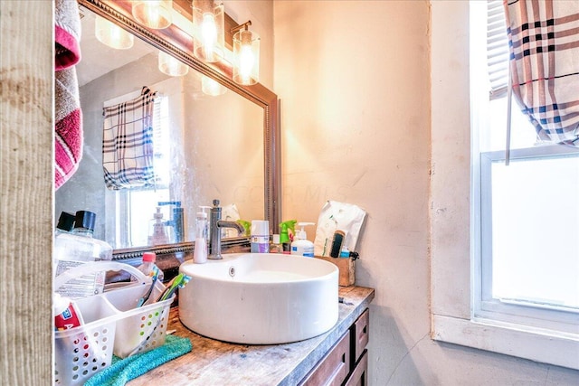 bathroom with plenty of natural light and vanity