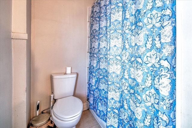 bathroom featuring tile patterned flooring and toilet