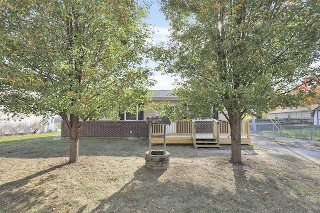 view of yard with a wooden deck