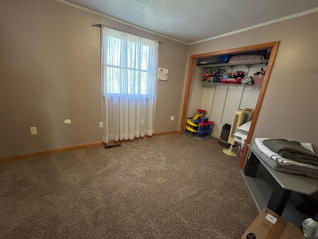 misc room featuring carpet, a textured ceiling, and ornamental molding