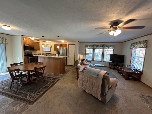 living room featuring dark colored carpet, ceiling fan, crown molding, and a textured ceiling