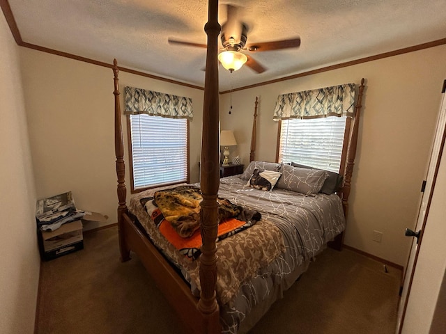 bedroom featuring a textured ceiling, dark carpet, ceiling fan, and crown molding