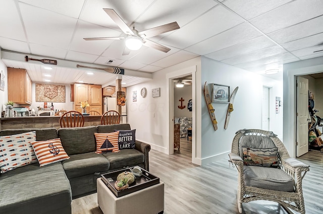 514 Mount Vernon Ave, Thornville, OH 43076 - living room with light wood-style floors, a ceiling fan, and a drop ceiling