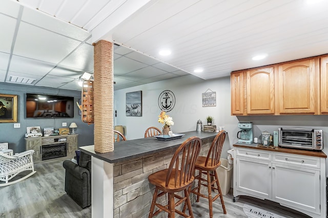 514 Mount Vernon Ave, Thornville, OH 43076 - bar area with light wood-type flooring, recessed lighting, and a fireplace