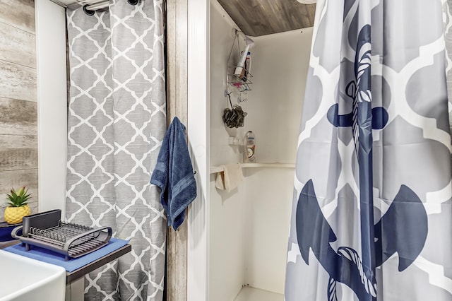 bathroom with wood ceiling