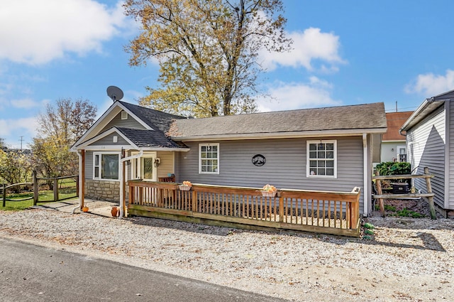 single story home featuring a deck