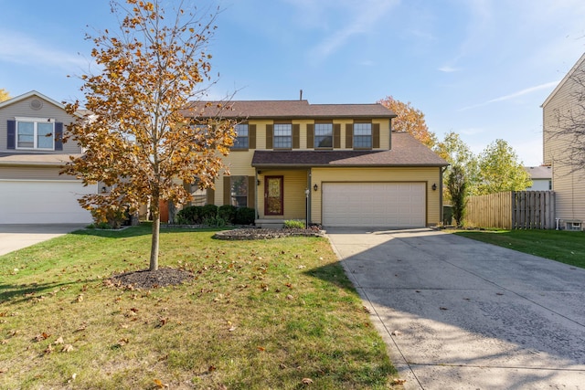 view of front of property featuring a front lawn and a garage