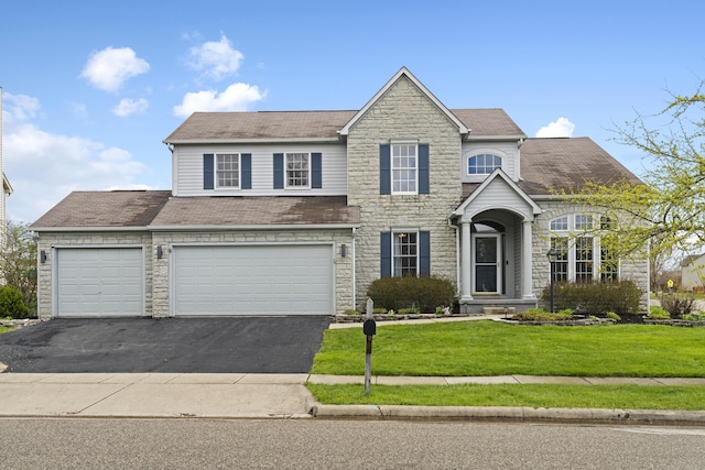 traditional home featuring aphalt driveway, stone siding, and a front lawn