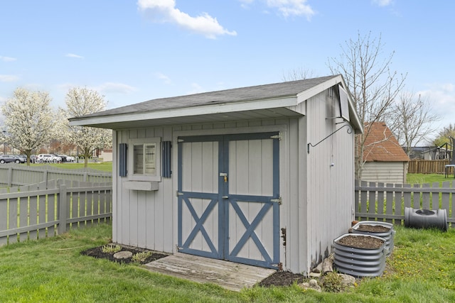 view of shed featuring fence