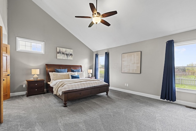 carpeted bedroom with high vaulted ceiling, baseboards, multiple windows, and visible vents