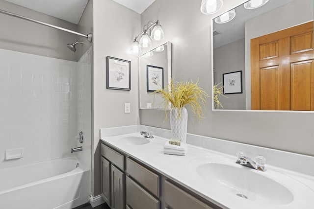bathroom with a sink, double vanity, and  shower combination