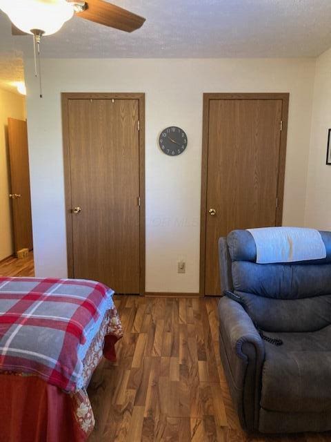 bedroom with hardwood / wood-style flooring and ceiling fan