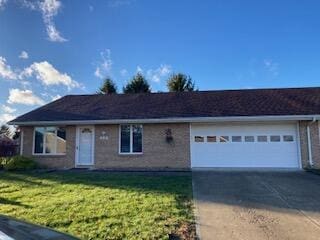 single story home with a garage and a front yard