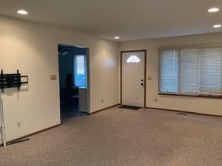 view of carpeted foyer