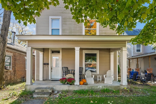 back of house with a porch