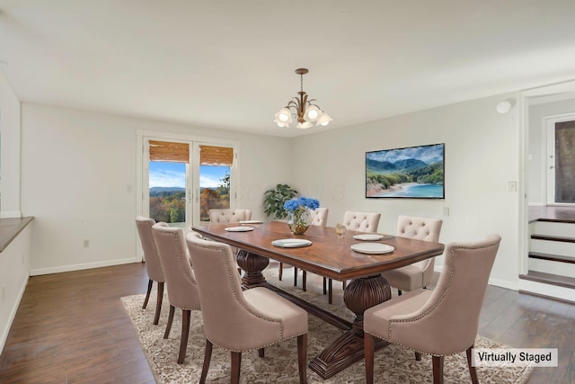 dining room with dark hardwood / wood-style floors and an inviting chandelier