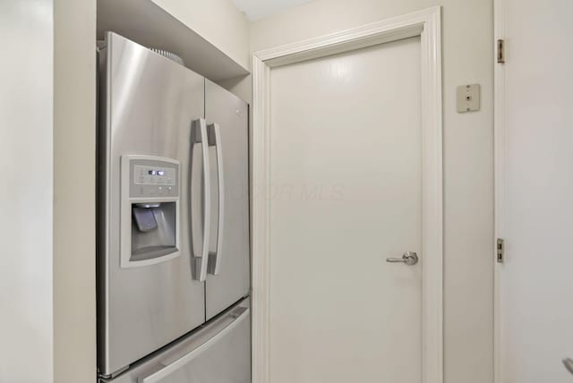 kitchen with stainless steel refrigerator with ice dispenser