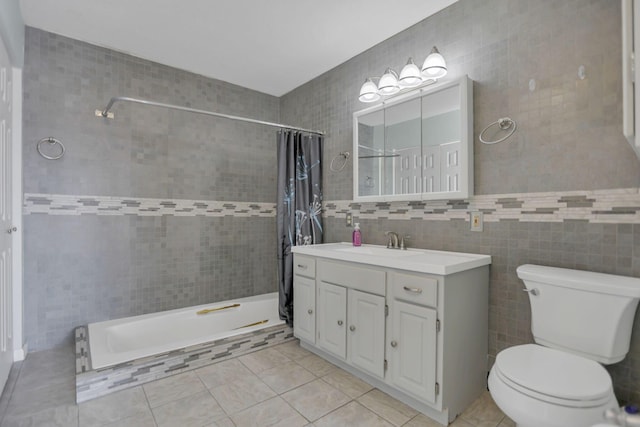 bathroom with a shower with shower curtain, tile patterned flooring, toilet, and tile walls