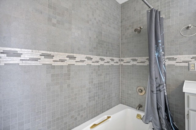 bathroom featuring shower / tub combo with curtain and tile walls