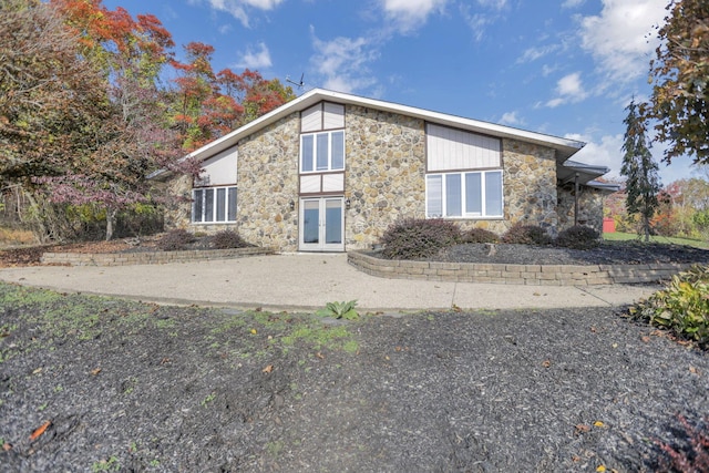 back of property featuring french doors