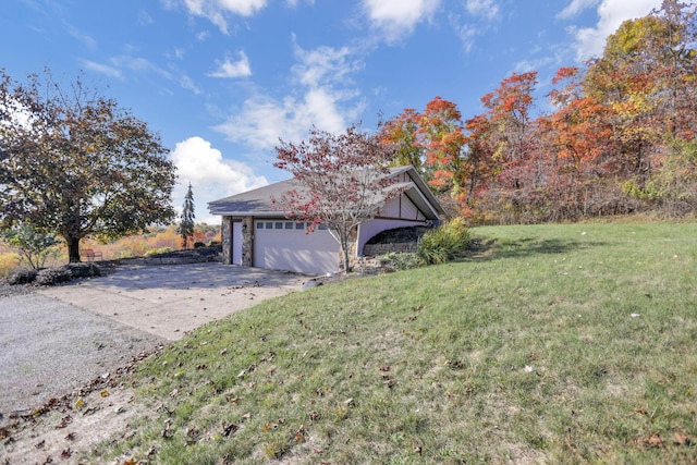 exterior space with a garage and a yard