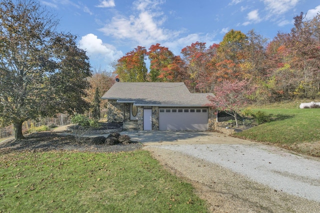 exterior space with a garage and a front yard