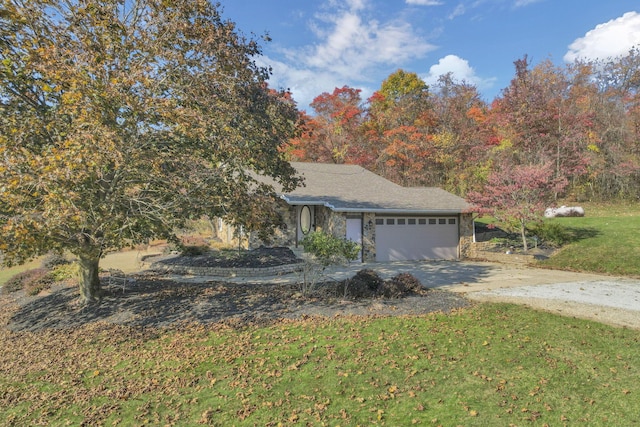 view of front facade with a front lawn and a garage