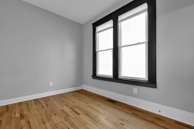 unfurnished room featuring light hardwood / wood-style floors