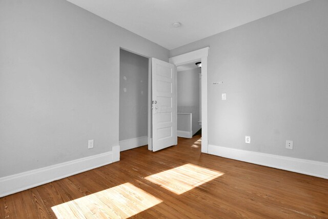 unfurnished bedroom featuring hardwood / wood-style floors