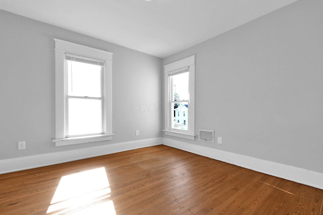 unfurnished room featuring wood-type flooring