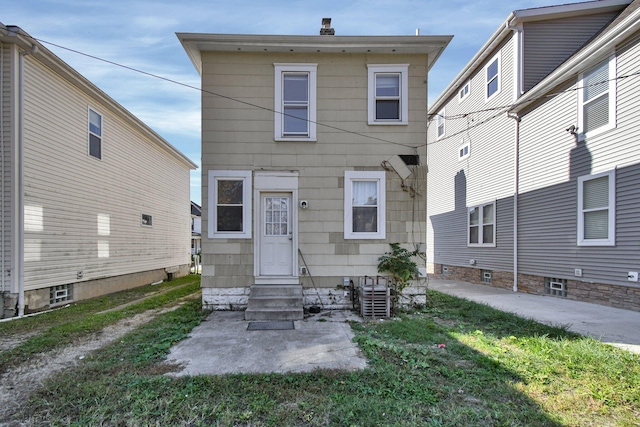 exterior space with a yard and central AC unit